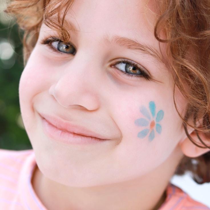 Ava Singh, Lead Design Curator at Tran Quil Meadow Lands, reviewing corporate floral arrangements